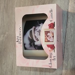 Kim Anderson glowing art candle of girl in pink hat